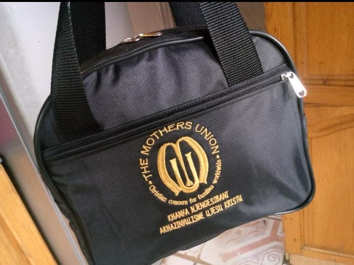 Black school bag with gold embroidered crest